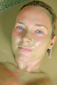 Woman in a clay bath.